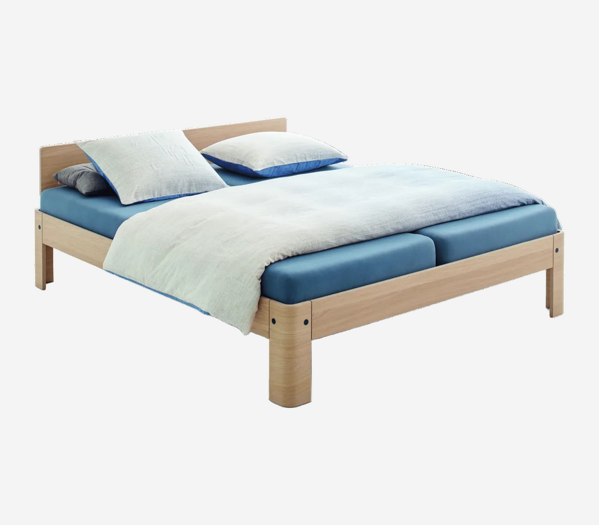 Bed with wooden frame and blue mattress on a white background