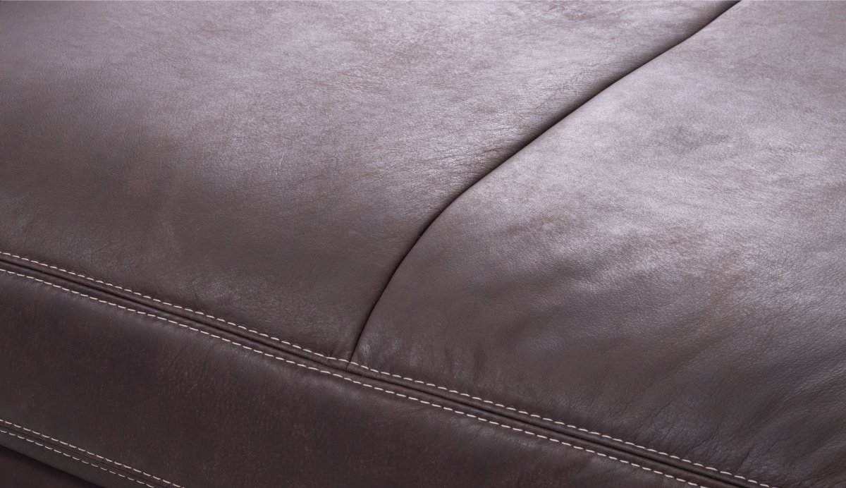 Close-up of brown leather with visible stitching