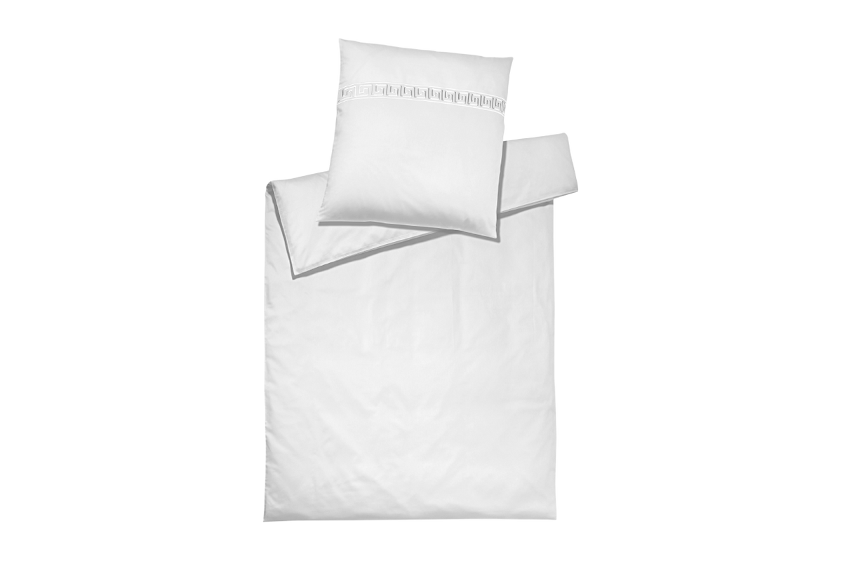 White bedding pillow set with Greek patterns on a white background