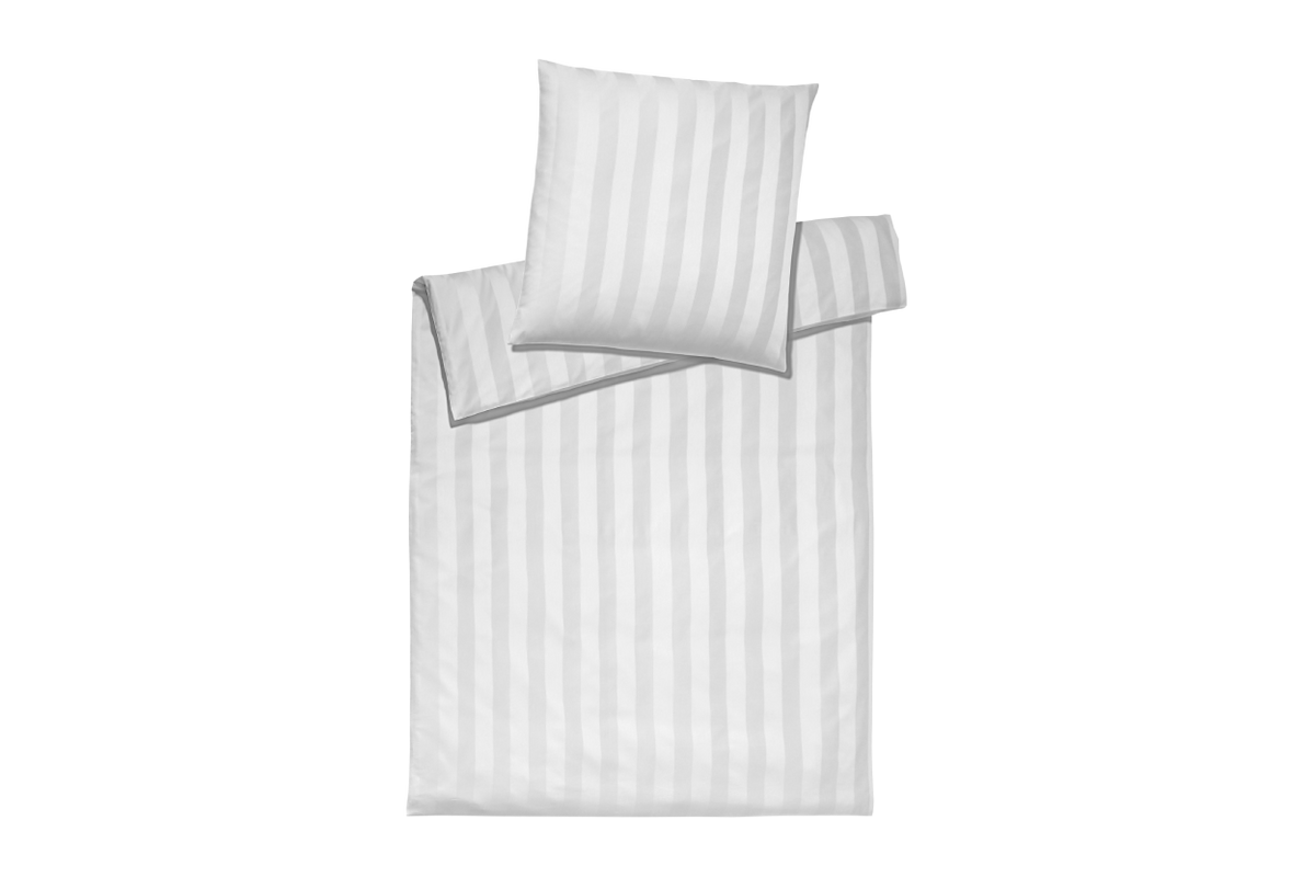 Striped bedding set with a pillow on a white background