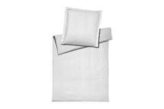 White ribbed bedding cover set and pillowcase set on a white background
