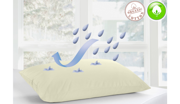 Pillow with water droplets and 'organic cotton' label on a light background