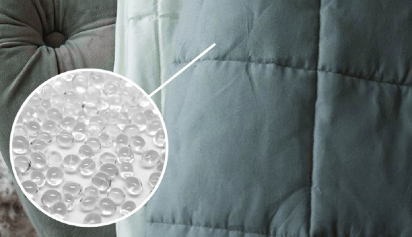 Close-up of a textured fabric surface with a detailed pattern, showing the material's texture.