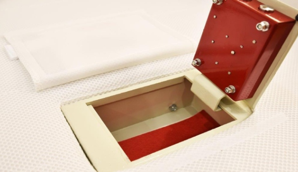 Red and beige hidden safe in a mattress