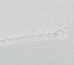 Close-up of a zipper on a white background