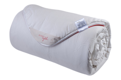Rolled-up white blanket with a label on a white background