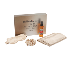 Hollandia Luxury Royal Silk gift set with a box, eye mask, scrub, and oil on a white background.