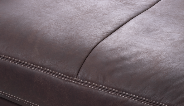 Close-up of brown leather with visible stitching
