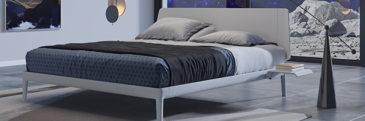 Modern bedroom with an Auping Essential bed, side tables, and decorative elements.