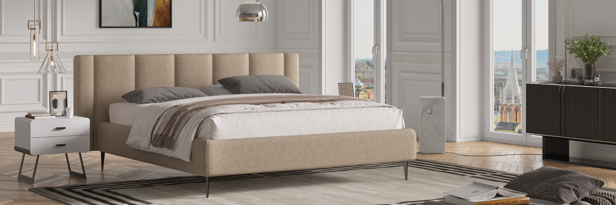 Modern bedroom with a large Sicily bed, side tables, and a floor lamp.