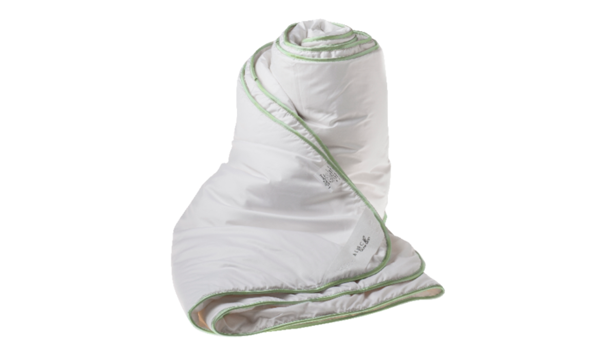 White blanket  with green trim on a white background