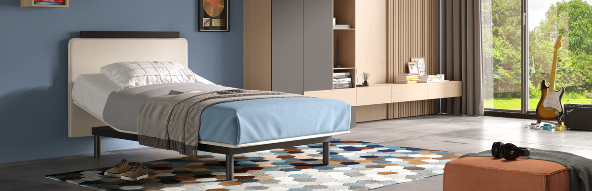Modern bedroom with a Smart One bed, shelves, and large windows.